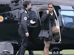 Brad Pitt getting out of a helicopter